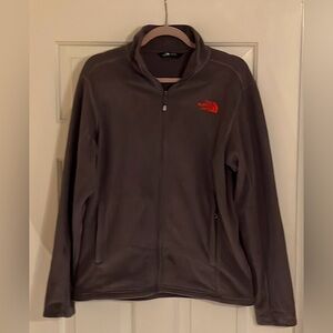 The North Face Fleece with full zipper. All gray with red logo.